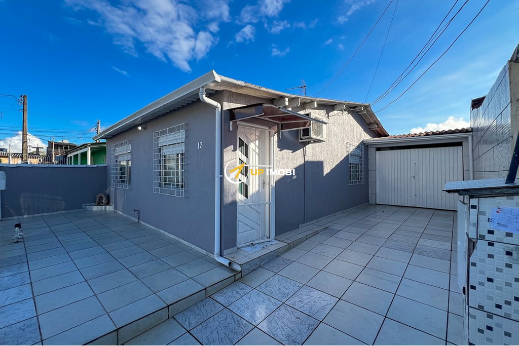 Casa com 82m², 2 dormitórios no bairro Guajuviras em Canoas para Comprar