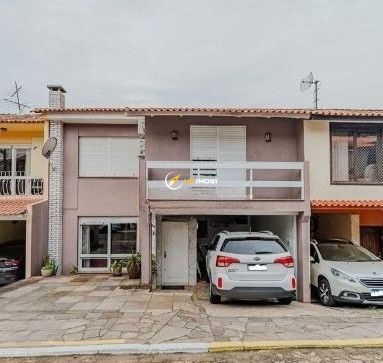 Casa de Condomínio, 4 dormitórios no bairro Santo Antônio em Porto Alegre para Comprar