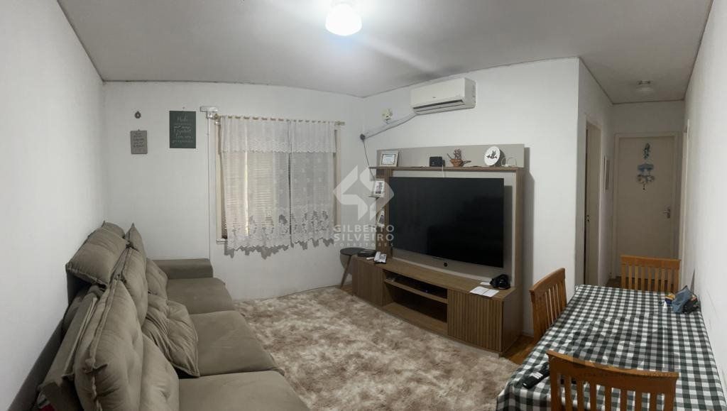 Apartamento de 2 dormitórios, living, cozinha, área de serviço e banheiro social.