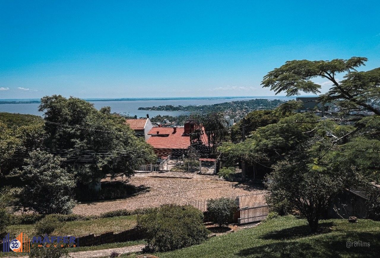 Casa bairro Sétimo Céu, 463m² privativos, vista privilegiada do Rio Guaíba em terreno de 1.423m².