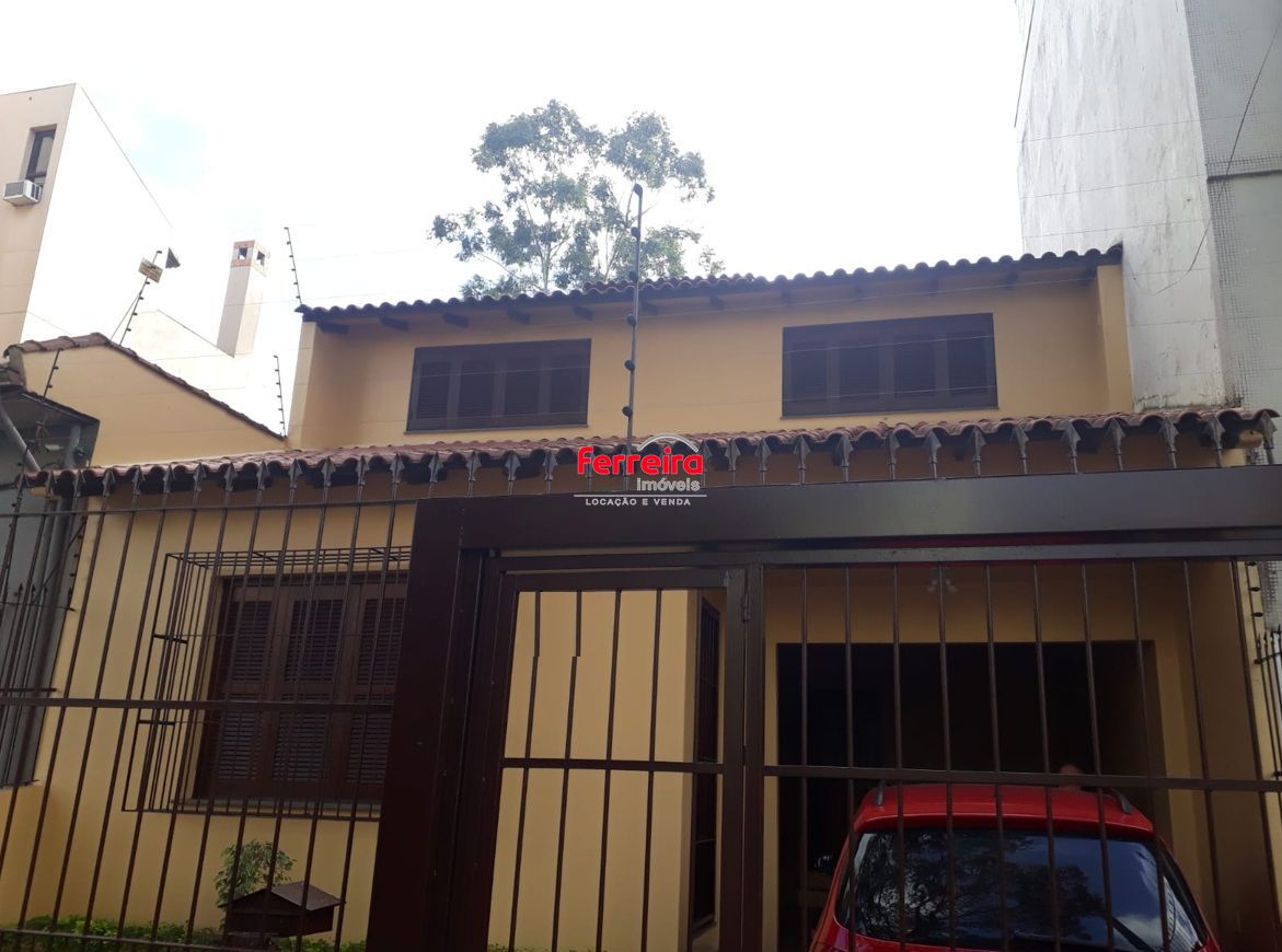 Casa sobrado no bairro Auxiliadora de 3 dormitórios e 3 vagas