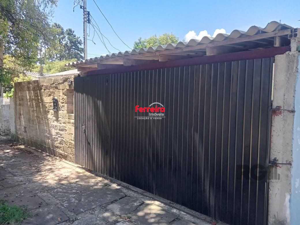 Casa com 2 dormitórios, vaga, amplo pátio, no bairro Santa Rosa de Lima, Poa/RS