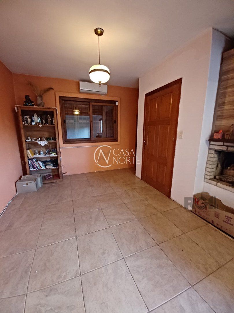 Casa à venda com 3 quartos, 144m², 2 vagas, Estrada João Passuelo no bairro Vila Nova em Porto Alegre