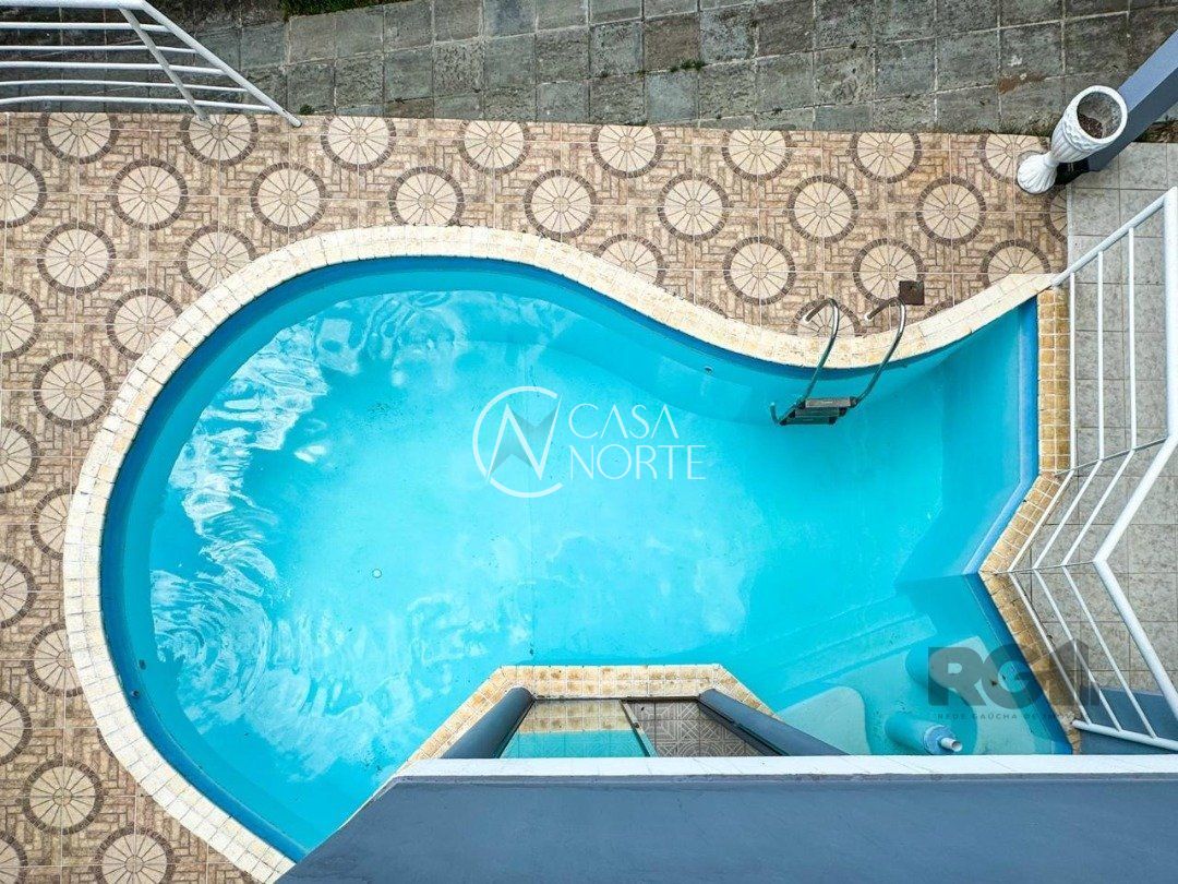 Casa de Condomínio à venda com 4 quartos, 435m², 4 suítes, 6 vagas, Rua Tocantins no bairro Lomba do Pinheiro em Porto Alegre