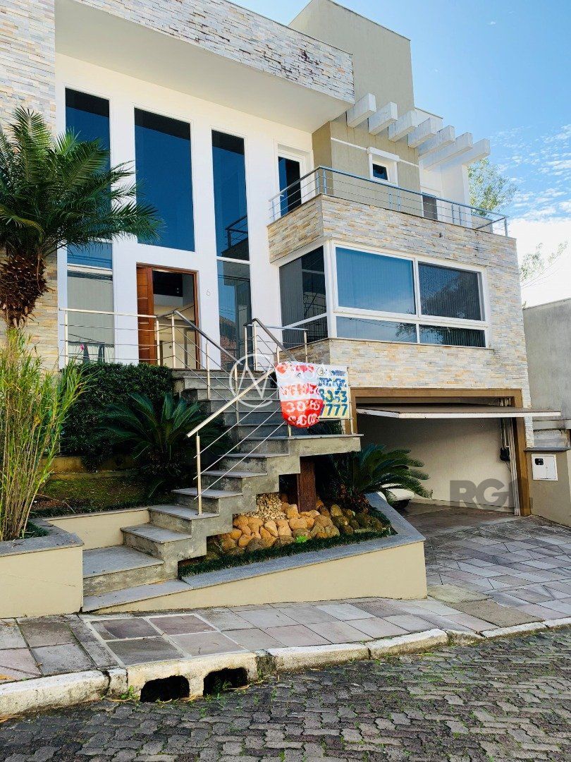 Casa de Condomínio à venda com 3 quartos, 397m², 3 suítes, 4 vagas, Rua Tocantins no bairro Lomba do Pinheiro em Porto Alegre