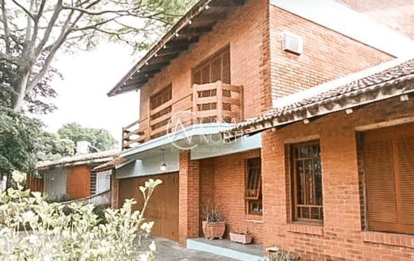 Casa à venda com 4 quartos, 404m², 1 suíte, 7 vagas, Rua Guaiana no bairro Vila Assunção em Porto Alegre