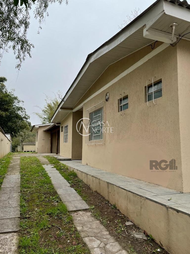 Casa à venda com 3 quartos, 150m², 3 vagas, Rua Miguel Ascoleze no bairro Vila Nova em Porto Alegre