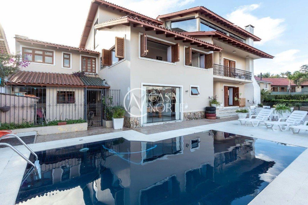 Casa à venda com 6 quartos, 960m², 5 suítes, 8 vagas, Rua Genny Zachia Stephanou no bairro Ipanema em Porto Alegre