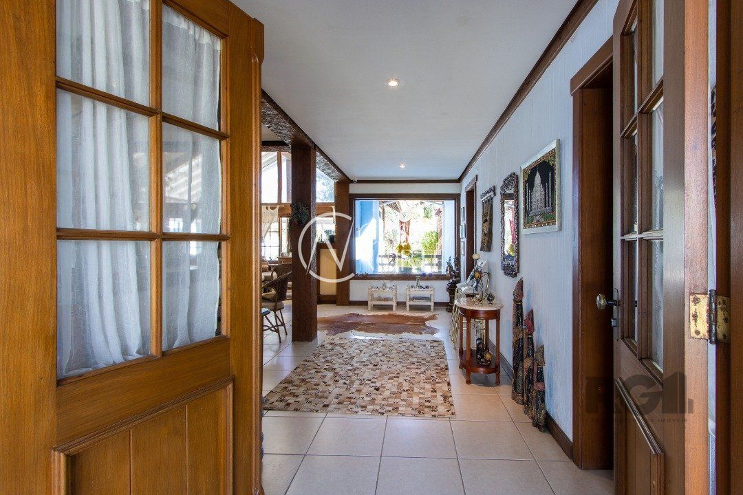 Casa de Condomínio à venda com 3 quartos, 250m², 3 suítes, 4 vagas, Avenida Juca Batista no bairro Belém Novo em Porto Alegre