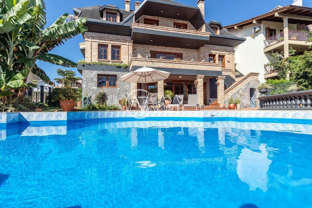 Casa de Condomínio à venda com 4 quartos, 559m², 3 suítes, 3 vagas, Avenida Firmino Octavio Bimbi no bairro Cavalhada em Porto Alegre