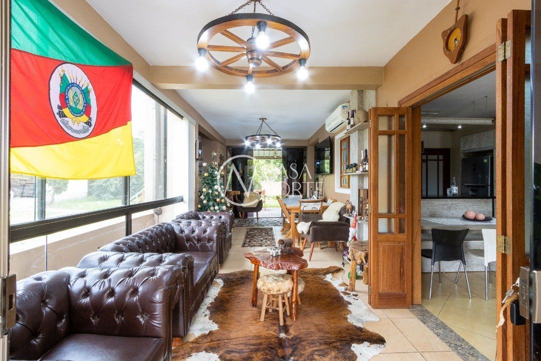 Casa à venda com 3 quartos, 190m², 1 suíte, 2 vagas, Rua do Jesuíno - Lado Ímpar no bairro Boa Vista do Sul em Porto Alegre