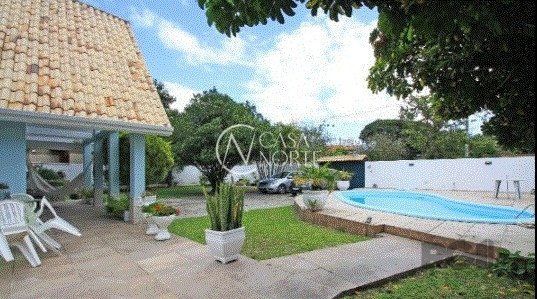 Casa à venda com 4 quartos, 291m², 1 suíte, 4 vagas, Avenida Orleaes no bairro Guarujá em Porto Alegre