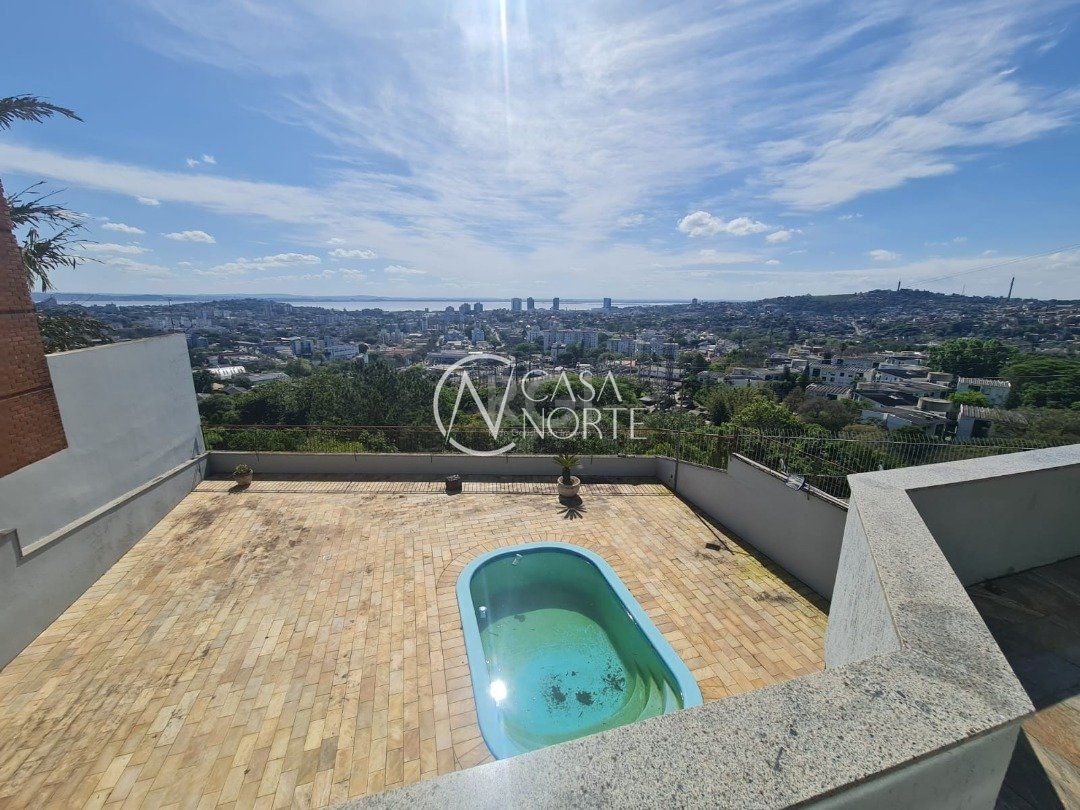 Casa à venda com 5 quartos, 464m², 4 suítes, 4 vagas, Rua Alcebiades Antônio dos Santos no bairro Nonoai em Porto Alegre