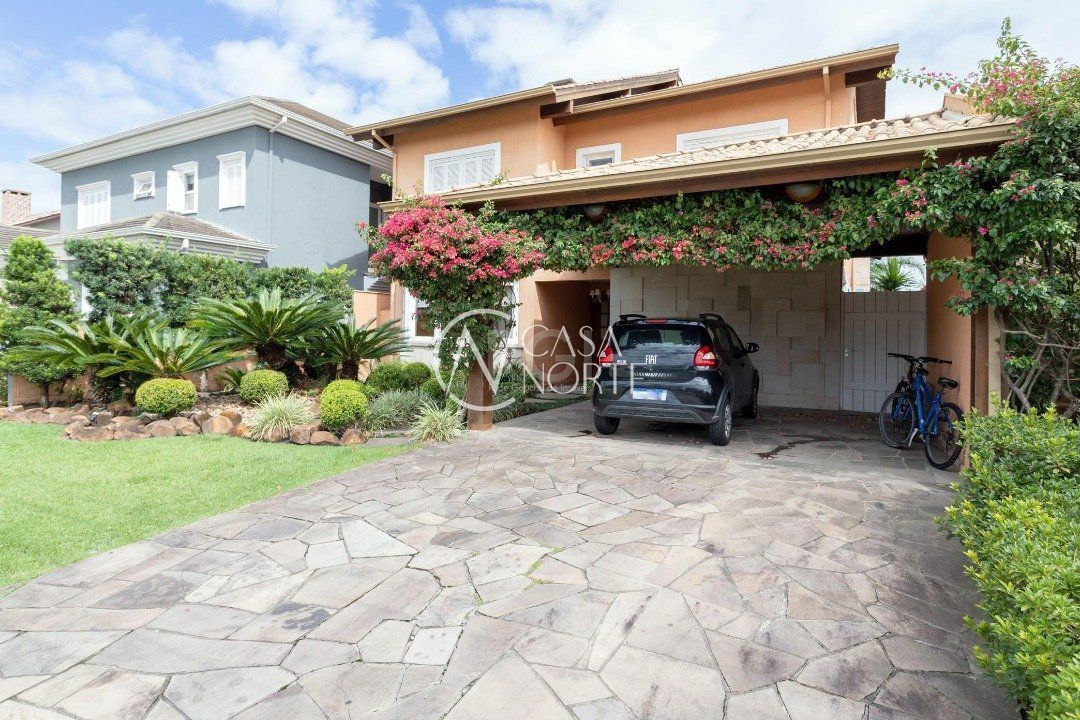 Casa de Condomínio à venda com 4 quartos, 386m², 4 suítes, 4 vagas, Avenida Juca Batista no bairro Belém Novo em Porto Alegre