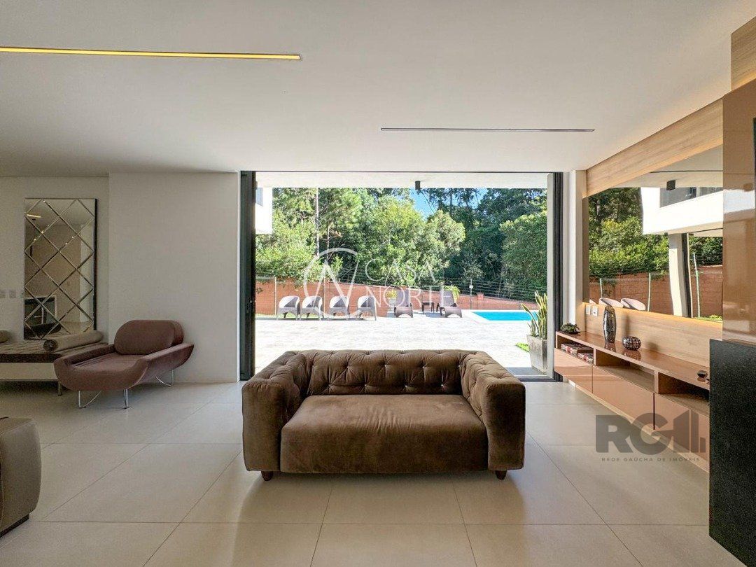 Casa de Condomínio à venda com 4 quartos, 340m², 4 suítes, 4 vagas, Estrada das Três Meninas no bairro Vila Nova em Porto Alegre