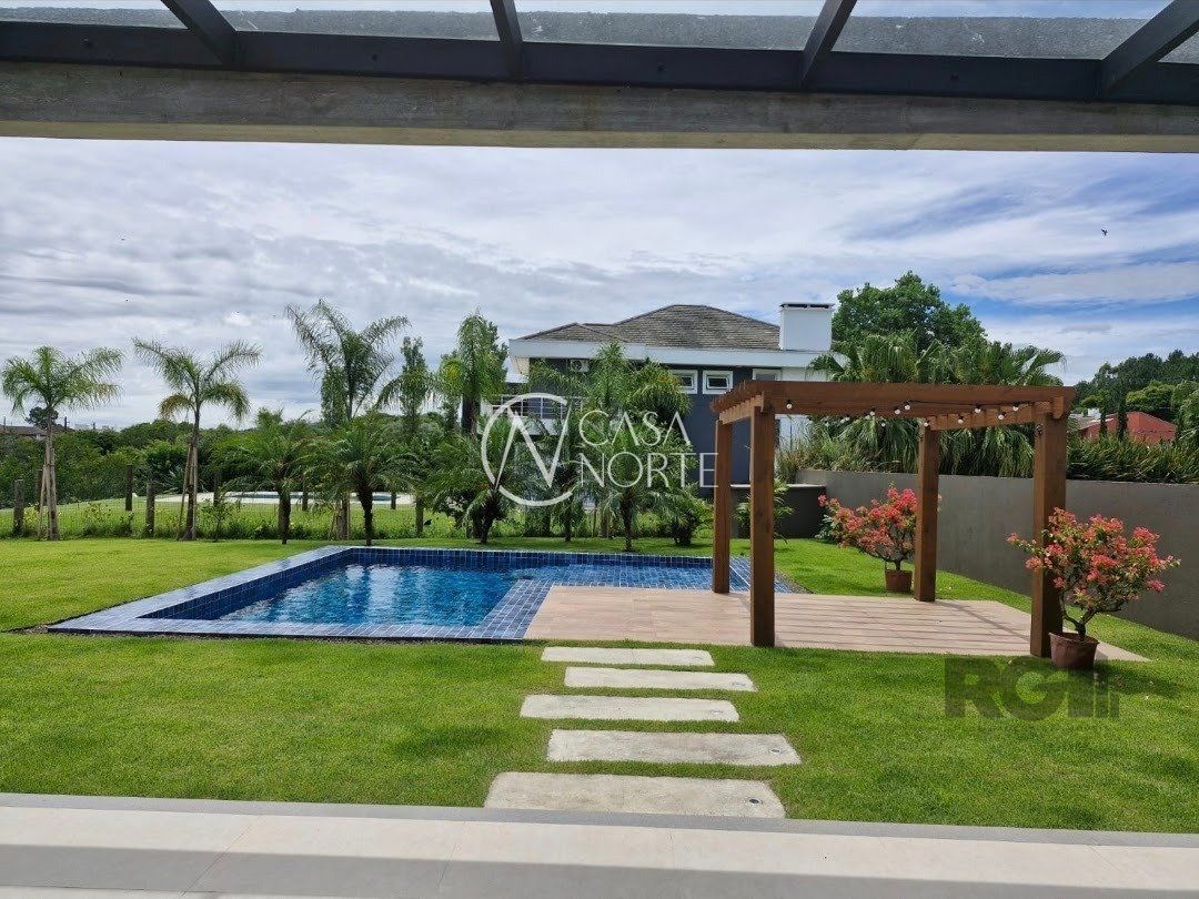 Casa de Condomínio à venda com 3 quartos, 370m², 3 suítes, 3 vagas, Avenida Juca Batista no bairro Belém Novo em Porto Alegre