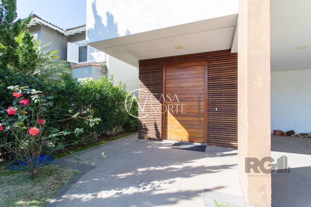 Casa de Condomínio à venda com 3 quartos, 426m², 3 suítes, 2 vagas, Avenida Juca Batista no bairro Belém Novo em Porto Alegre