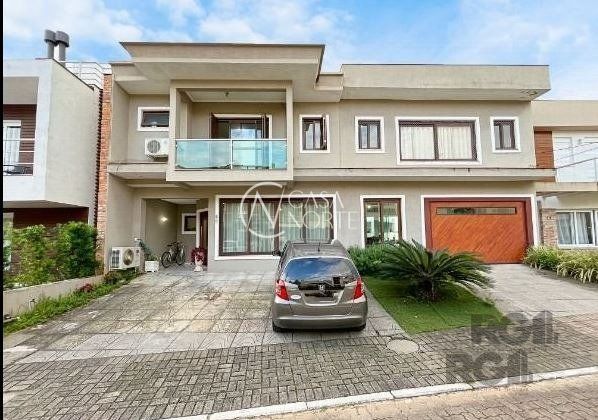 Casa de Condomínio à venda com 3 quartos, 315m², 1 suíte, 3 vagas, Rua Carlos Maximiliano Fayet no bairro Hípica em Porto Alegre