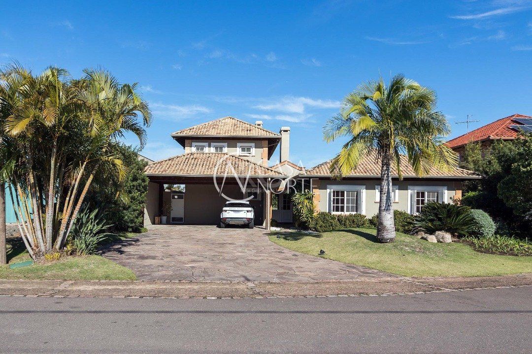 Casa de Condomínio à venda com 3 quartos, 449m², 3 suítes, 4 vagas, Avenida Juca Batista no bairro Belém Novo em Porto Alegre