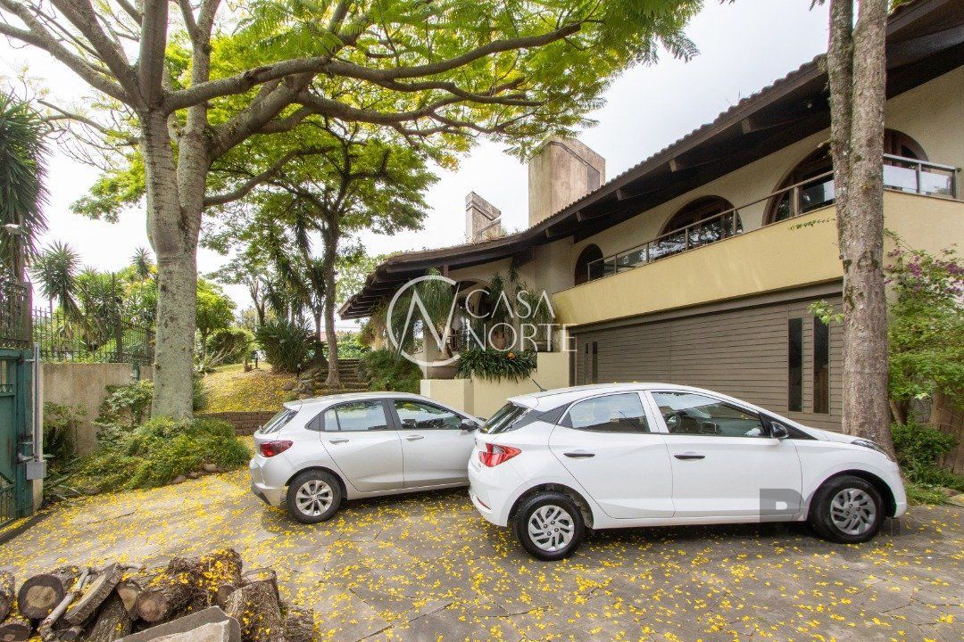 Casa à venda com 4 quartos, 645m², 4 suítes, 2 vagas, Rua Sargento Nicolau Dias de Farias no bairro Tristeza em Porto Alegre