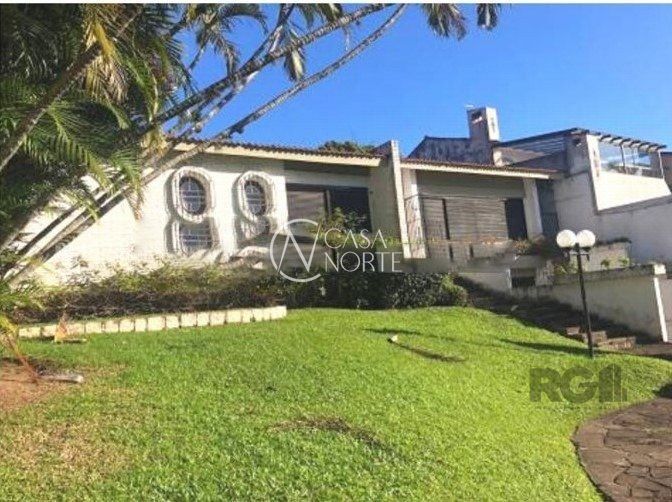 Casa à venda com 5 quartos, 305m², 4 suítes, 2 vagas, Avenida Jacuí no bairro Cristal em Porto Alegre