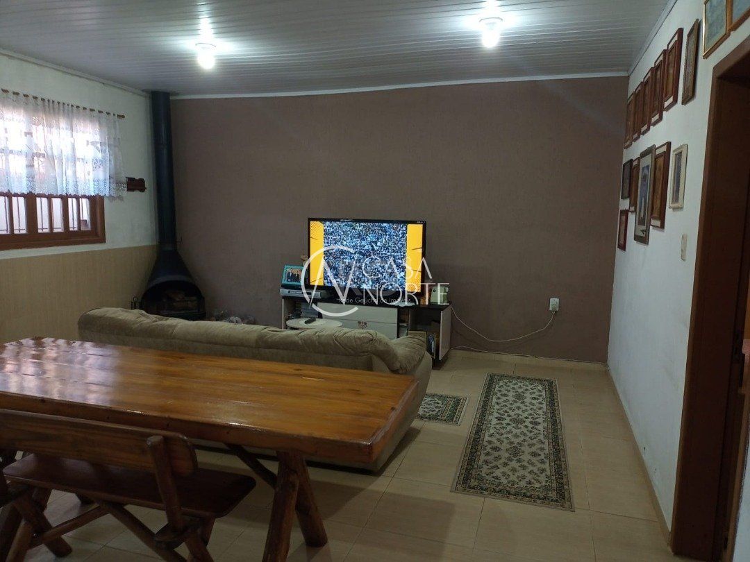 Casa à venda com 3 quartos, 180m², 1 suíte, 2 vagas, Rua Catulo da Paixao Cearense no bairro Vila Nova em Porto Alegre