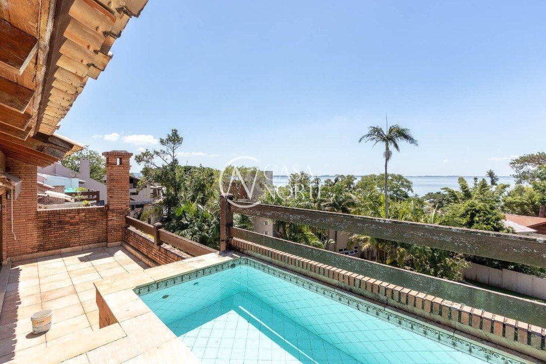 Casa de Condomínio à venda com 4 quartos, 331m², 4 suítes, 2 vagas, Rua Carlos Julio Becker no bairro Tristeza em Porto Alegre