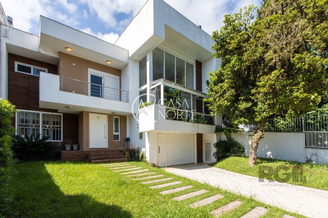 Casa à venda com 3 quartos, 296m², 3 suítes, 2 vagas, Avenida Fábio Araújo Santos no bairro Nonoai em Porto Alegre