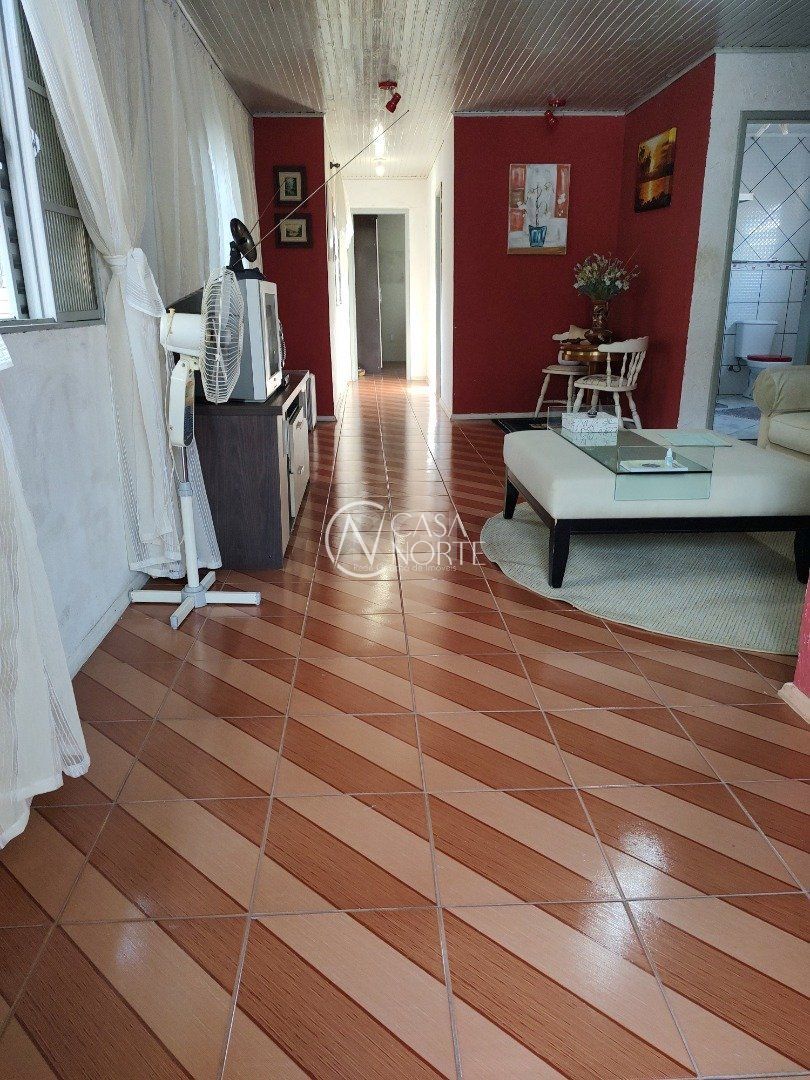 Casa à venda com 3 quartos, 335m², 4 vagas, Rua Martim Minaberry no bairro Partenon em Porto Alegre