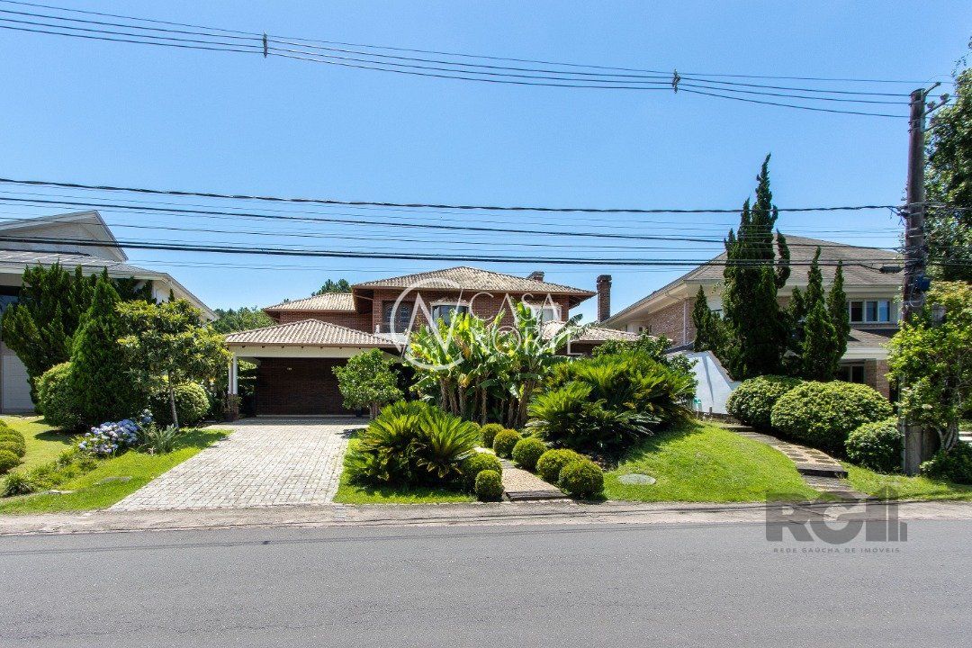 Casa de Condomínio à venda com 4 quartos, 516m², 4 suítes, 4 vagas, Avenida Juca Batista no bairro Belém Novo em Porto Alegre