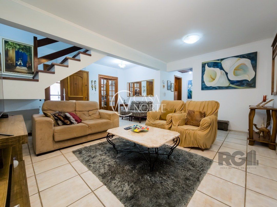 Casa de Condomínio à venda com 3 quartos, 233m², 1 suíte, 2 vagas, Avenida Eduardo Prado no bairro Cavalhada em Porto Alegre