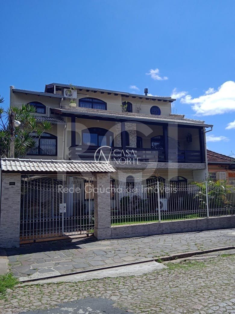 Casa à venda com 6 quartos, 750m², 3 suítes, 4 vagas, Rua Paissandu no bairro Partenon em Porto Alegre