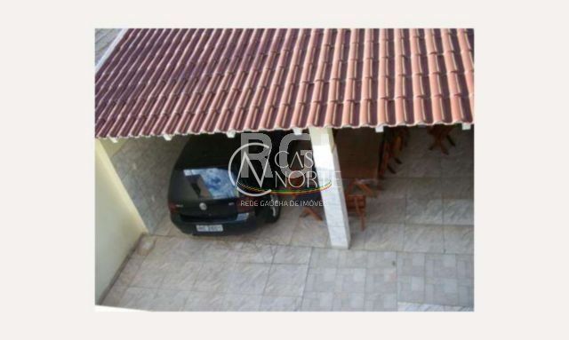 Casa à venda com 3 quartos, 185m², 3 vagas, Rua Guaracapa no bairro Santa Maria Goretti em Porto Alegre