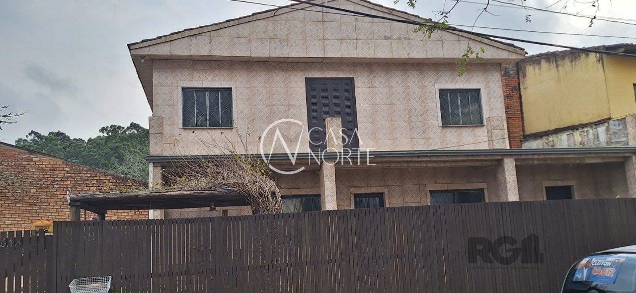 Casa à venda com 4 quartos, 136m², 4 vagas, Rua Agenor Mendes Ouriques no bairro Guarujá em Porto Alegre