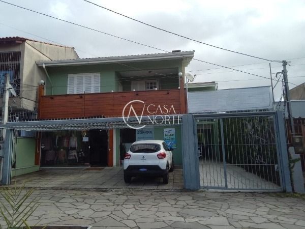 Casa à venda com 4 quartos, 409m², 1 suíte, 5 vagas, Travessa Escobar no bairro Camaquã em Porto Alegre