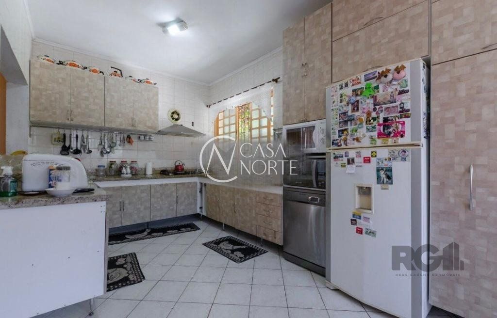 Casa à venda com 6 quartos, 408m², 1 suíte, 6 vagas, Rua Padre João Batista Reus no bairro Vila Conceição em Porto Alegre