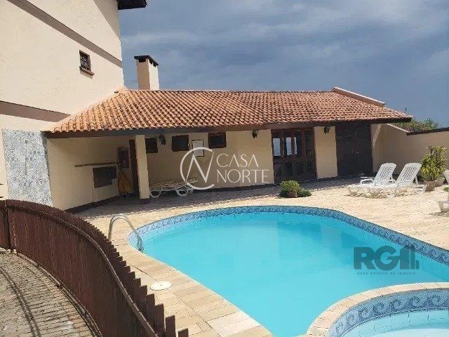 Casa de Condomínio à venda com 2 quartos, 179m², 1 suíte, 2 vagas, Avenida Wenceslau Escobar no bairro Tristeza em Porto Alegre