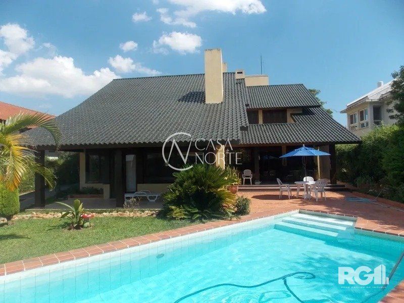 Casa de Condomínio à venda com 4 quartos, 450m², 4 suítes, 2 vagas, Avenida da Cavalhada no bairro Cavalhada em Porto Alegre