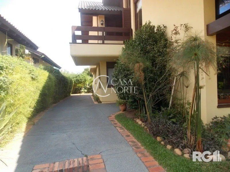 Casa de Condomínio à venda com 4 quartos, 450m², 4 suítes, 2 vagas, Avenida da Cavalhada no bairro Cavalhada em Porto Alegre