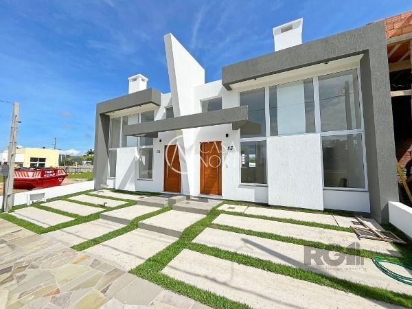 Casa de Condomínio à venda com 3 quartos, 91m², 1 suíte, 2 vagas, Rua Lucindo Antônio Bottin no bairro Hípica em Porto Alegre