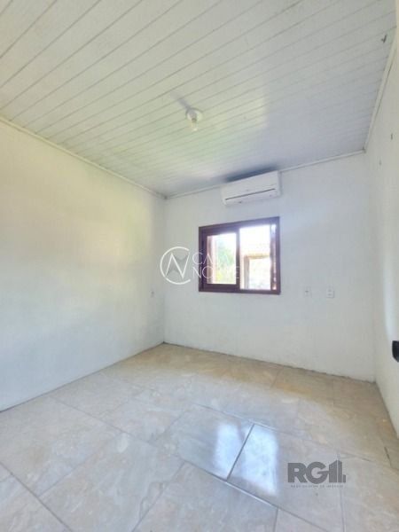 Casa à venda com 3 quartos, 150m², 2 suítes, 5 vagas, Rua das Magnólias no bairro Ponta Grossa em Porto Alegre