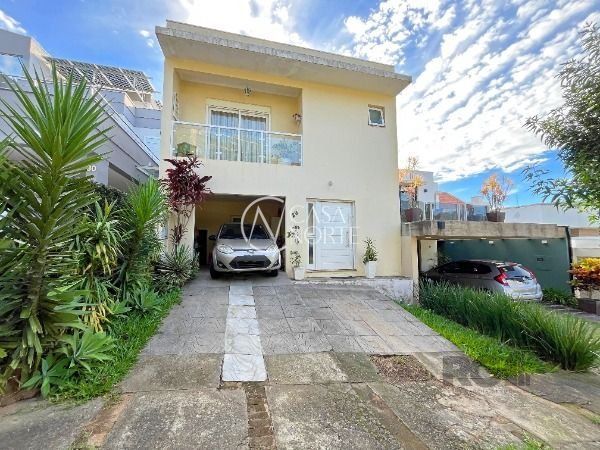 Casa de Condomínio à venda com 3 quartos, 194m², 1 suíte, Rua Adriano Pereira da Silva no bairro Vila Nova em Porto Alegre