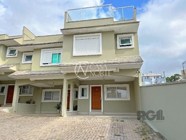 Casa de Condomínio à venda com 4 quartos, 210m², 3 suítes, 2 vagas, Rua Doutor Mário Totta no bairro Tristeza em Porto Alegre