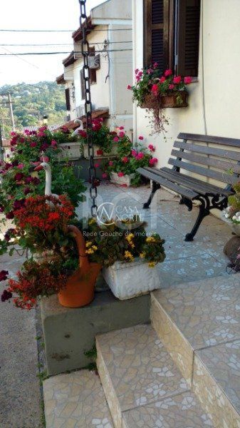 Casa de Condomínio à venda com 3 quartos, 79m², 1 vaga, Avenida Monte Cristo no bairro Vila Nova em Porto Alegre