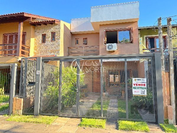 Casa à venda com 3 quartos, 137m², 1 suíte, 2 vagas, Rua Irany de Oliveira Santanna no bairro Hípica em Porto Alegre