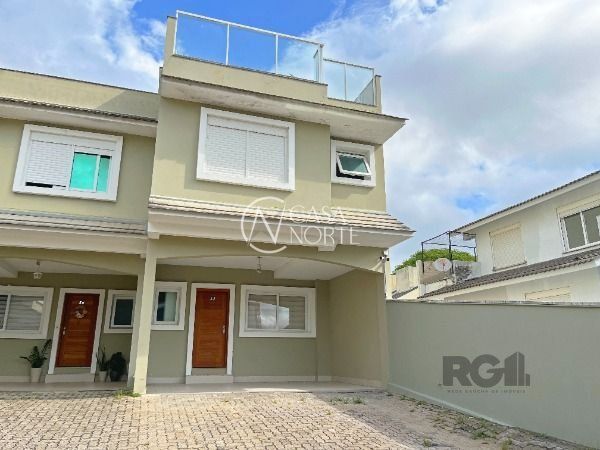 Casa de Condomínio à venda com 4 quartos, 210m², 3 suítes, 2 vagas, Rua Doutor Mário Totta no bairro Tristeza em Porto Alegre