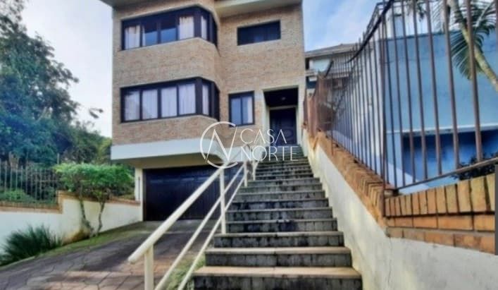 Casa à venda com 4 quartos, 276m², 2 suítes, 4 vagas, Rua Edgar Luiz Schneider no bairro Jardim Isabel em Porto Alegre