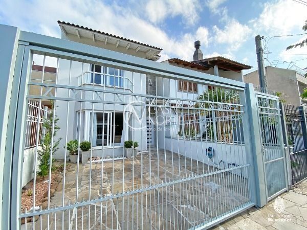 Casa à venda com 3 quartos, 131m², 1 suíte, 2 vagas, Rua Wilson Conceição Bona no bairro Hípica em Porto Alegre