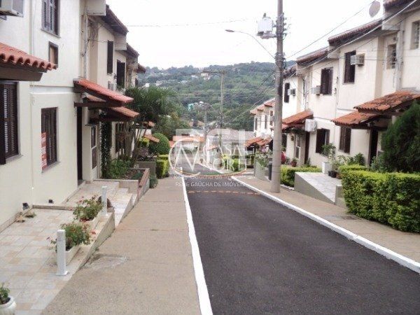 Casa de Condomínio à venda com 3 quartos, 79m², 1 vaga, Avenida Monte Cristo no bairro Vila Nova em Porto Alegre