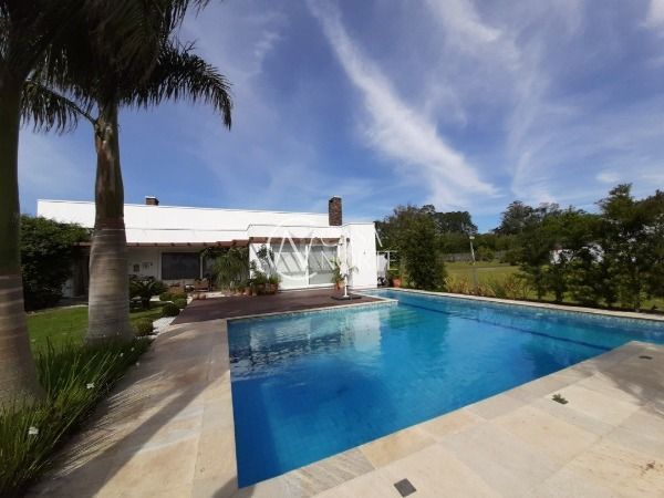 Casa de Condomínio à venda com 3 quartos, 320m², 3 suítes, 4 vagas, Avenida Juca Batista no bairro Belém Novo em Porto Alegre